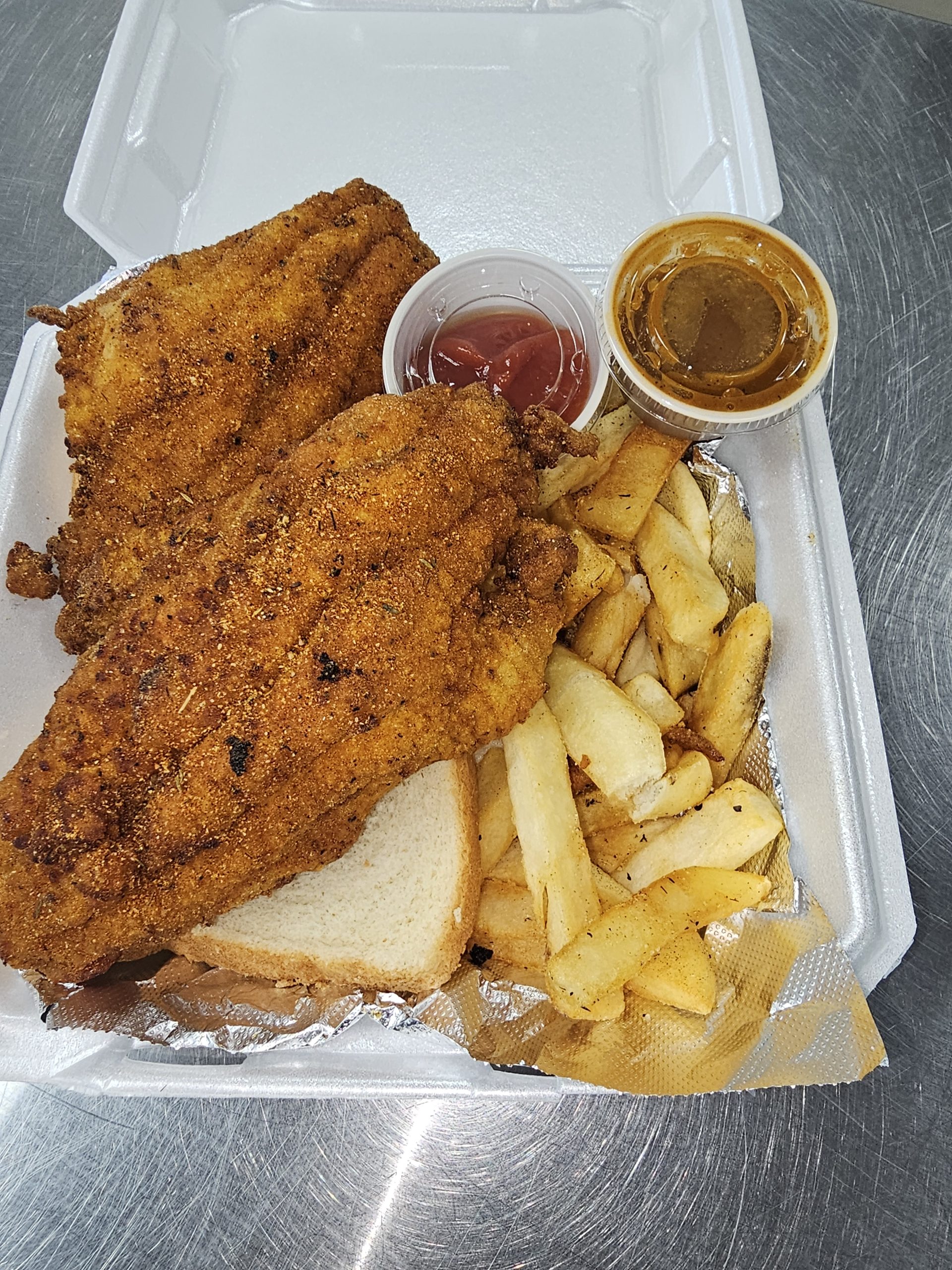 Hand-breaded catfish with hand-cut fries
